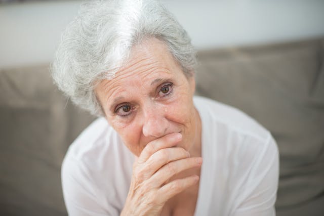 An Elderly Woman Crying