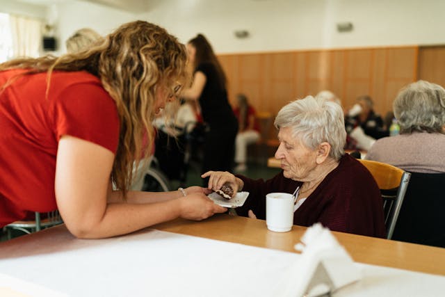 assisted living elderly woman eating