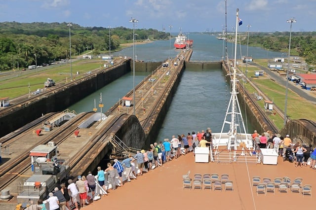 cruise ship passengers enjoying panama canal