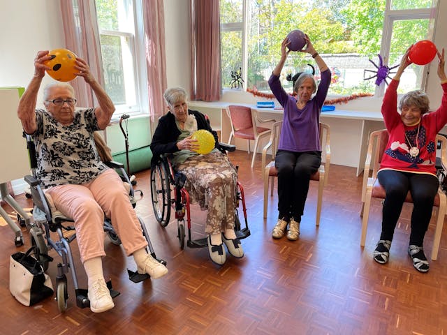 elderly women in nursing home doing activity