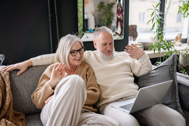 Elderly Couple Sitting on the Sofa video call