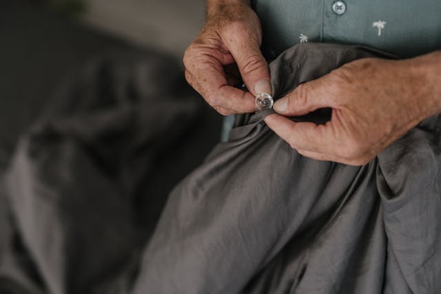 Person Holding Gray Textile