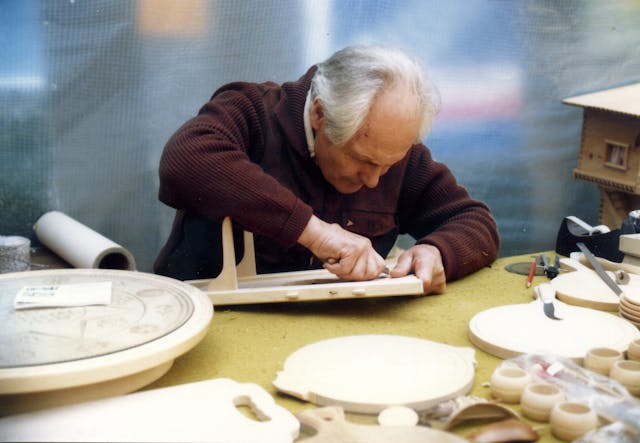 retired man woodworking