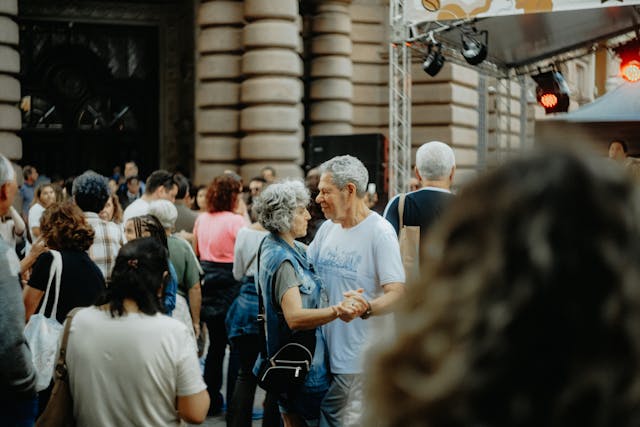 Elderly Couple Dancing at Outdoor Street Festival