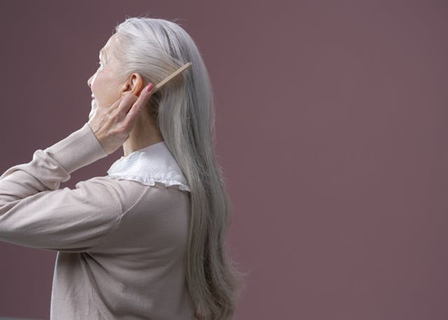 Elderly woman with long grey hair