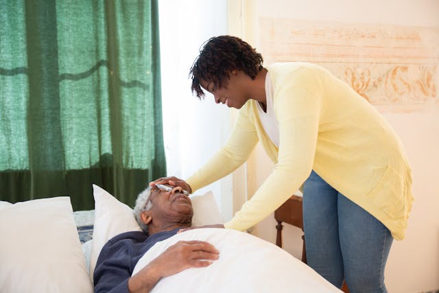 a caregiver comfort and care elderly man